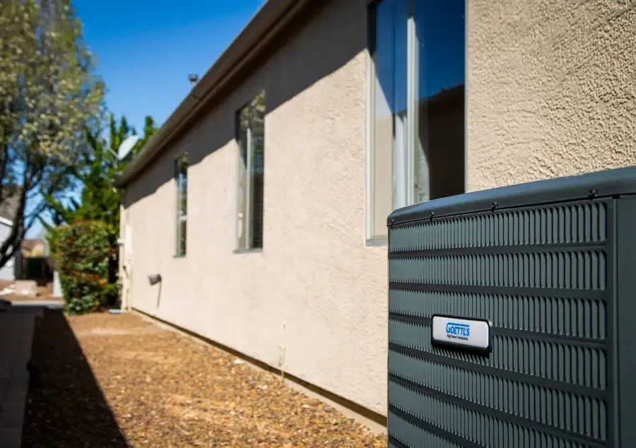 Goettl’s High Desert Mechanical outdoor AC unit beside home on gravel pad – Prescott Valley AZ