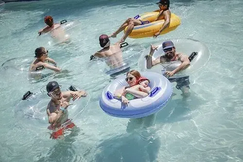 Kids and adults floating and playing in the pool on inflatable tubes during event – Goettl’s High Desert Mechanical Prescott Valley AZ