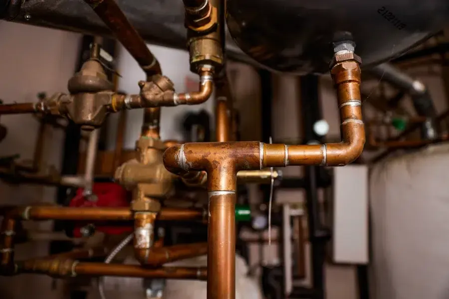 closeup of copper pipes and fittings