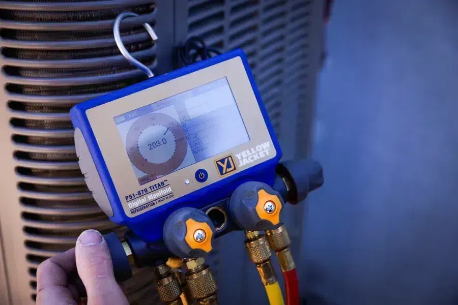 HVAC diagnostic gauges measuring system pressure during service call – Goettl’s High Desert Mechanical Prescott Valley AZ
