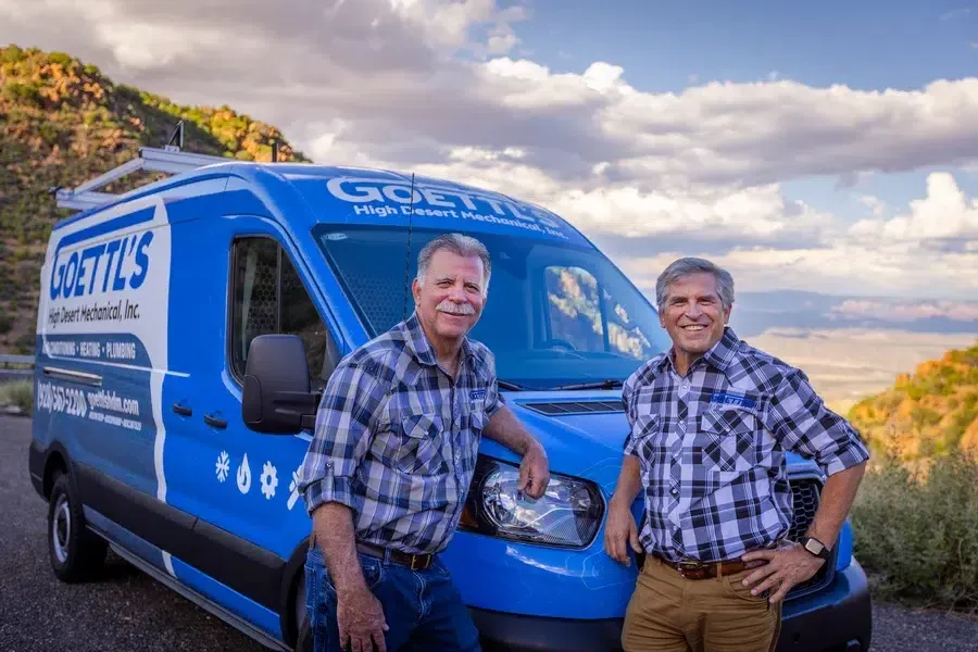 Goettl’s High Desert Mechanical team standing beside service van in desert mountain setting – Prescott Valley AZ