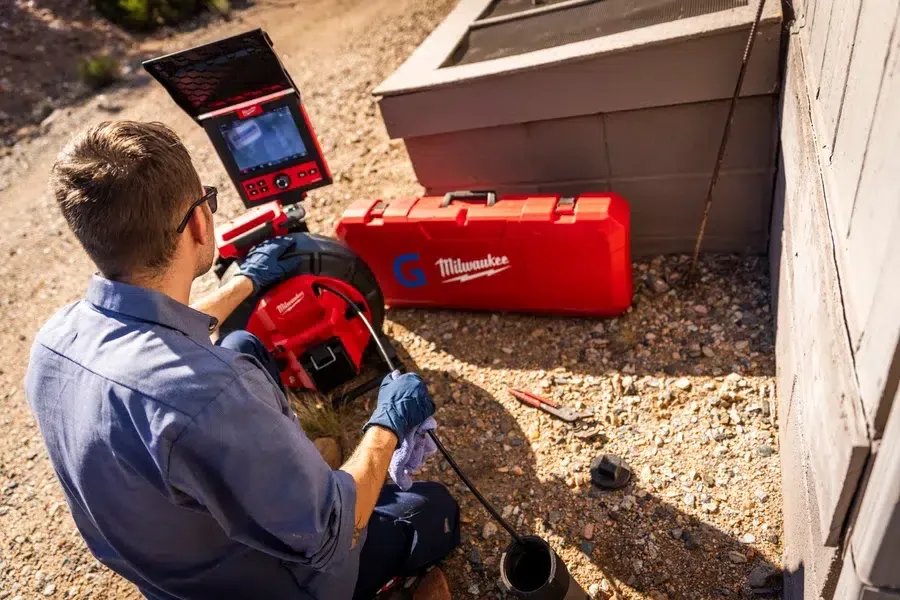 Goettl's technician using Milwaukee Pipeline Inspection System on sewer