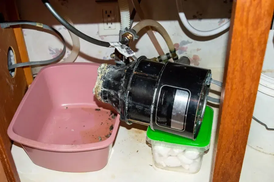 eroded garbage disposal under kitchen sink that needs to be replaced in Prescott Valley AZ