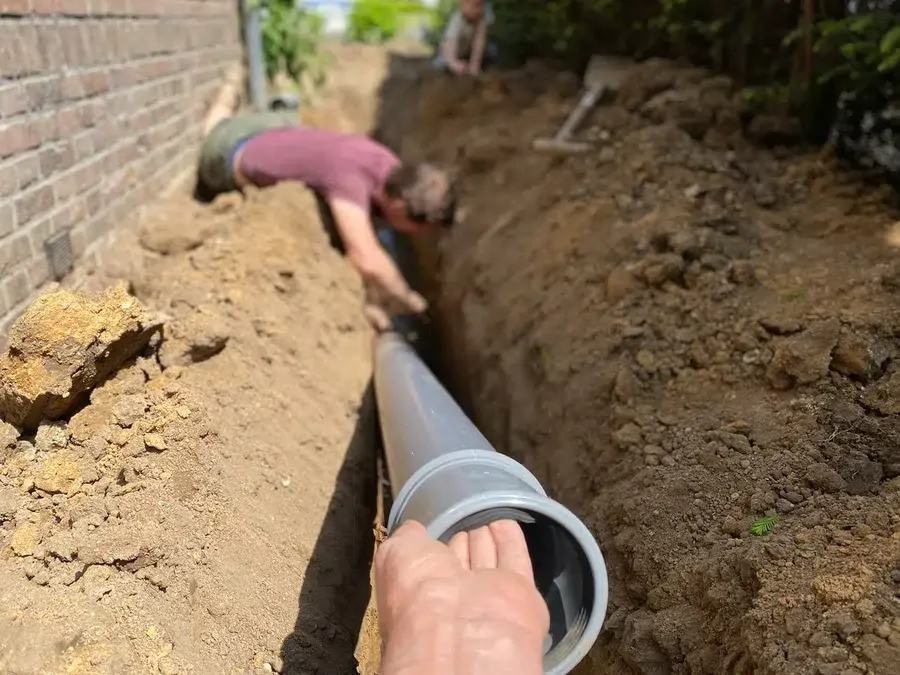 installing home sewer line in