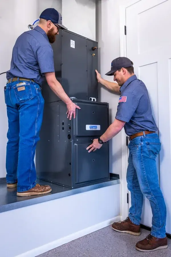 Goettl’s High Desert Mechanical technicians positioning indoor air handler during installation – Prescott Valley AZ