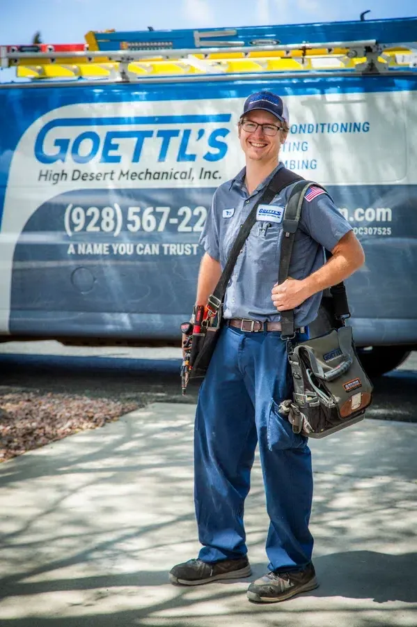 Goettl’s High Desert Mechanical technician posing in front of service van with tools – Prescott Valley AZ