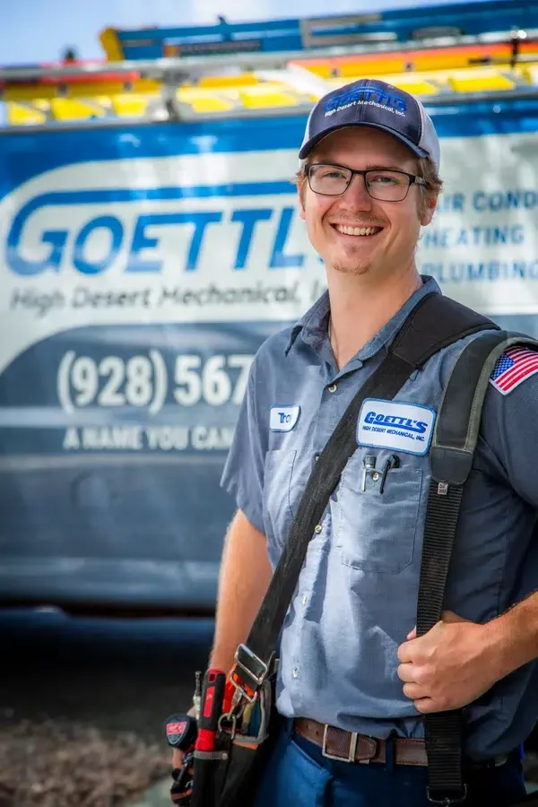 Goettl’s High Desert Mechanical technician standing in front of service van with tool bag – Prescott Valley AZ
