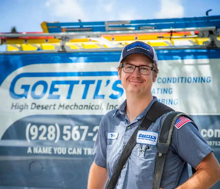 Goettl’s High Desert Mechanical technician smiling in front of branded service van – Prescott Valley AZ