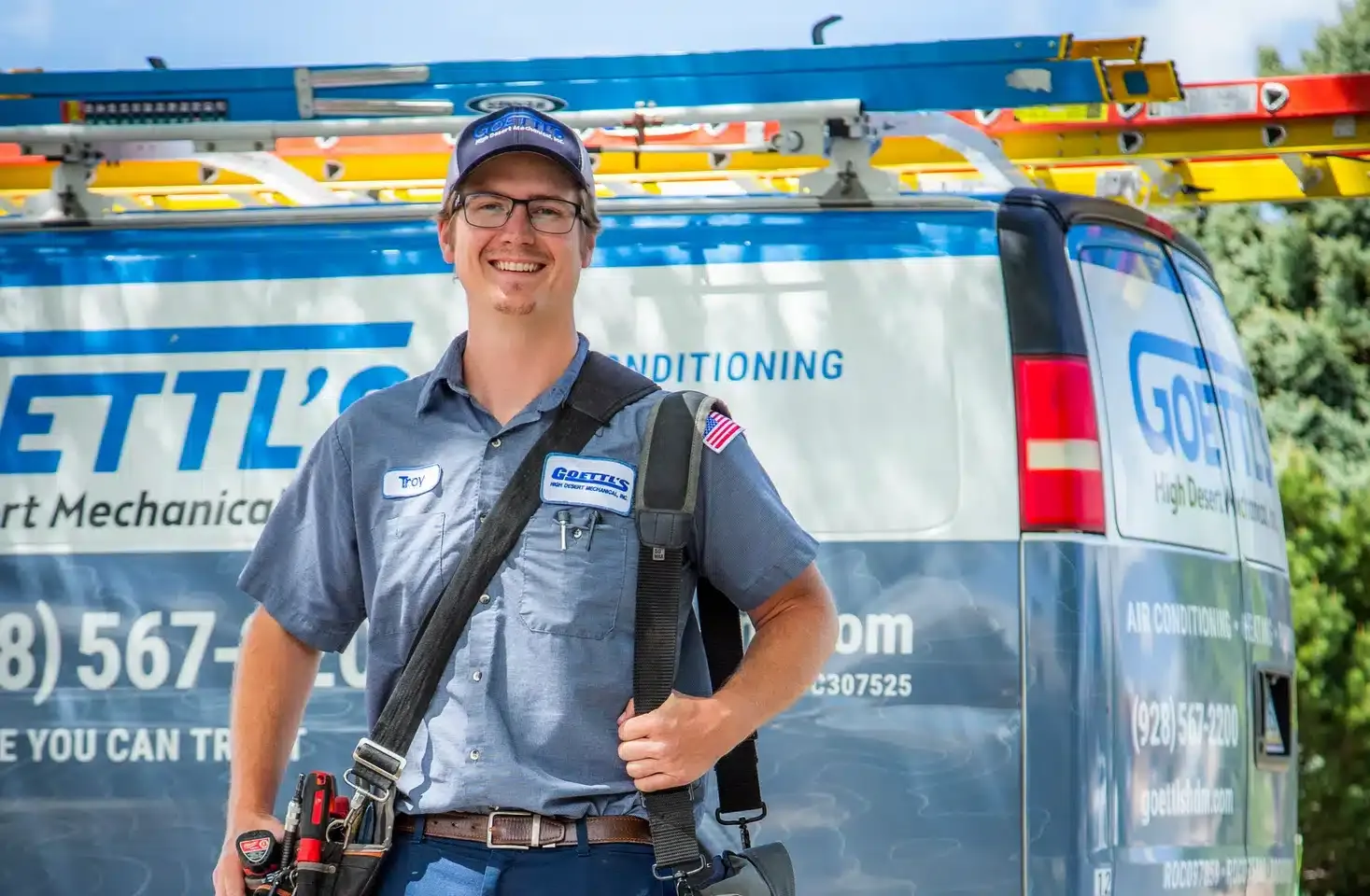 Goettl’s High Desert Mechanical technician in front of service van with tools – Prescott Valley AZ
