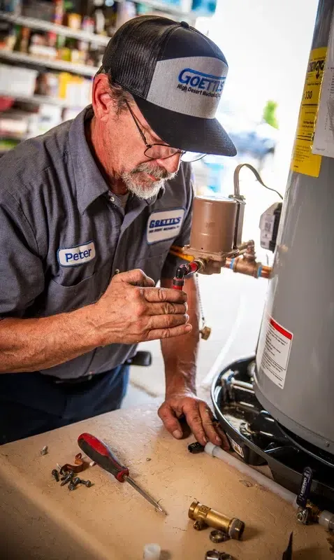 Goettl’s High Desert Mechanical plumber working on water heater – Prescott Valley AZ