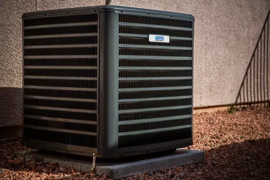 AC Side view of Goettl outdoor HVAC condenser on gravel pad – Prescott Valley AZ