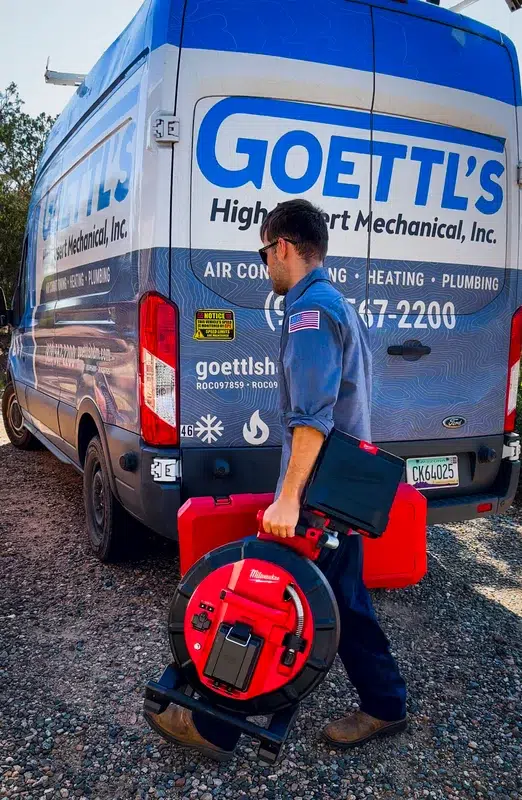Goettl's technician carrying Pipeline Inspection System