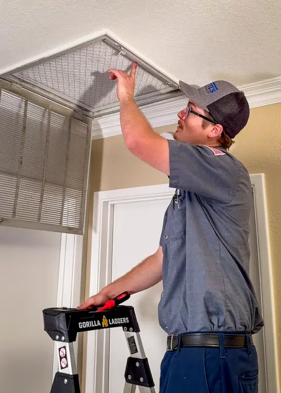 Goettl's tech installing new air filter in ceiling return vent – Goettl’s High Desert Mechanical Prescott Valley AZ