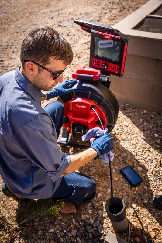 Goettl's technician using Milwaukee Pipeline Inspection System on sewer