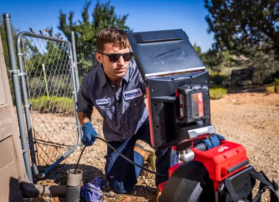 Goettl's technician using Milwaukee Pipeline Inspection System on sewer