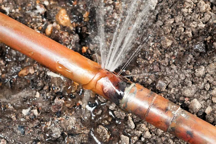 water line leak from copper pipe outside home spraying water – Prescott Valley AZ