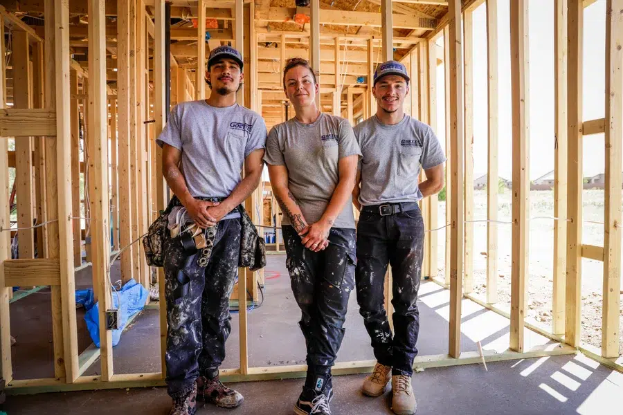 Two HVAC installers standing inside new construction home framing – Goettl’s High Desert Mechanical Prescott Valley AZ