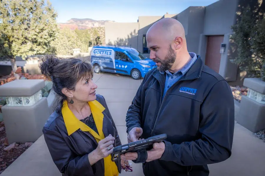 Goettl’s High Desert Mechanical technician speaking with homeowner about financing options – Prescott Valley AZ