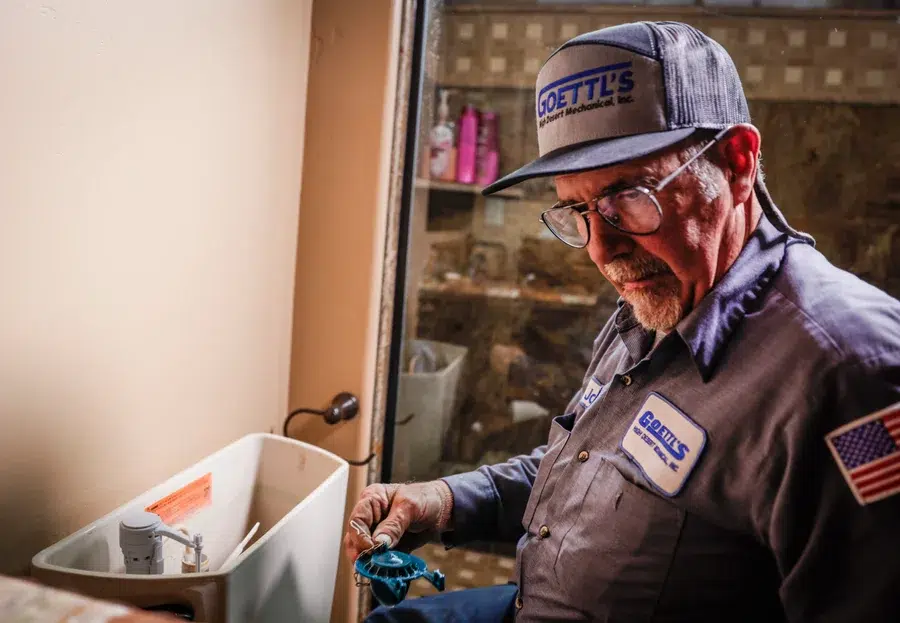 Goettl’s High Desert Mechanical plumber repairing toilet in home – Prescott Valley AZ